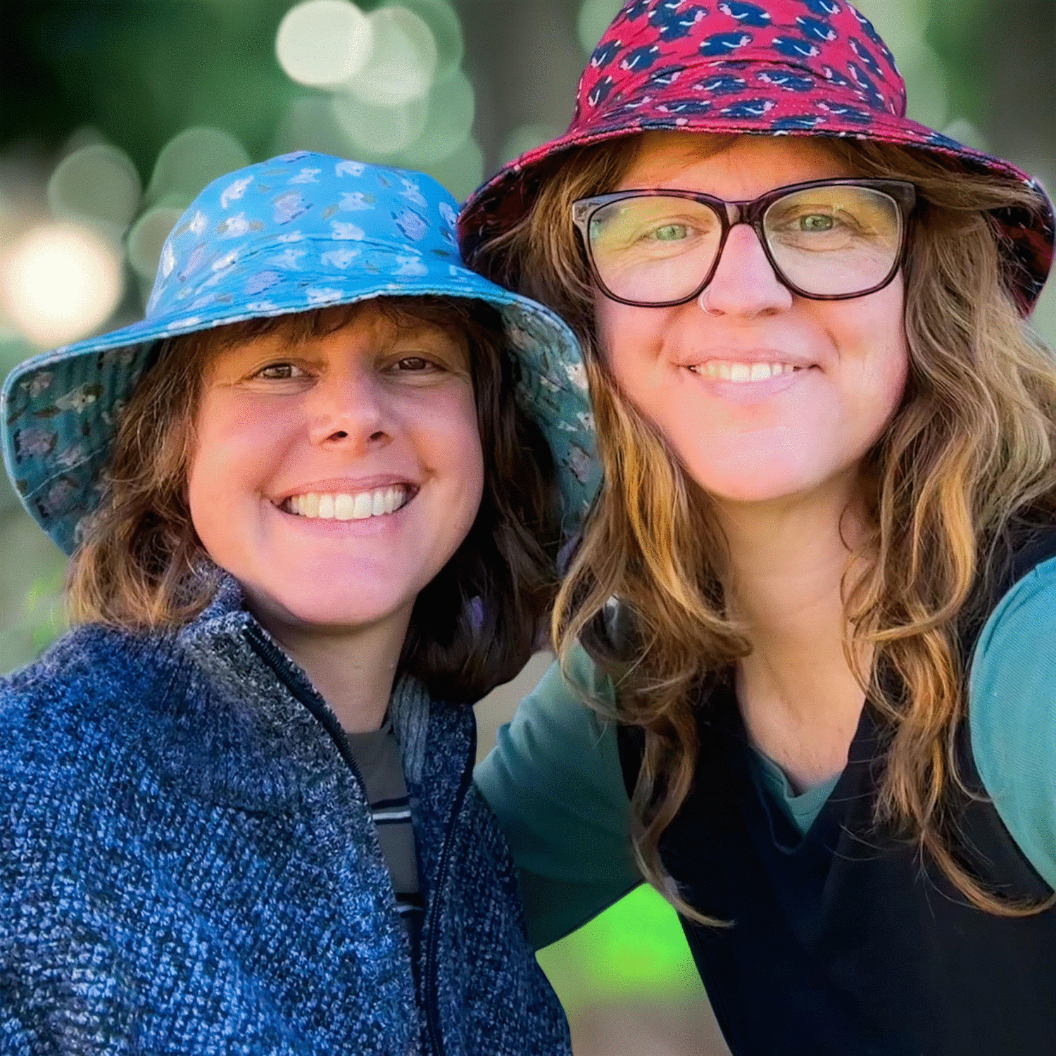 Jen and Tracy each wearing a hat